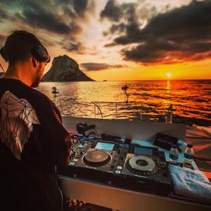 Don Diablo on a boat in Ibiza at sunset